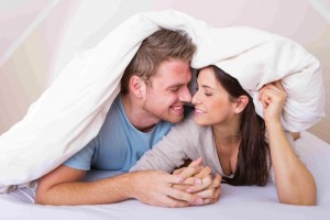 couple in bed 300x200 How to Get a Guy By Not Being Needy